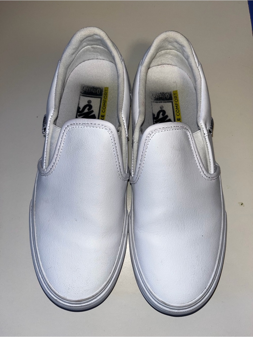White Slip-On Sneakers - Visible Insole Logo